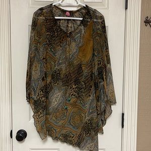 Beautiful top. Size large. Sheer material. See pictures for details